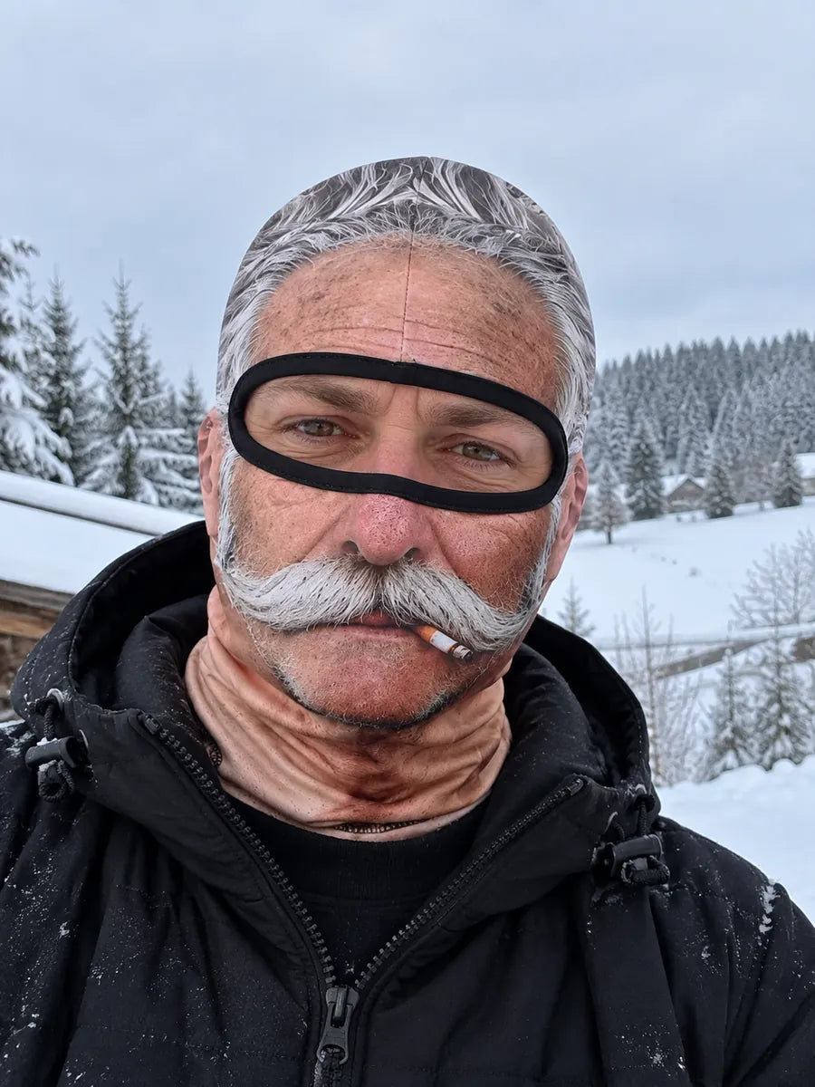Grey-haired Old Man Mask with a white moustache in a snowy landscape